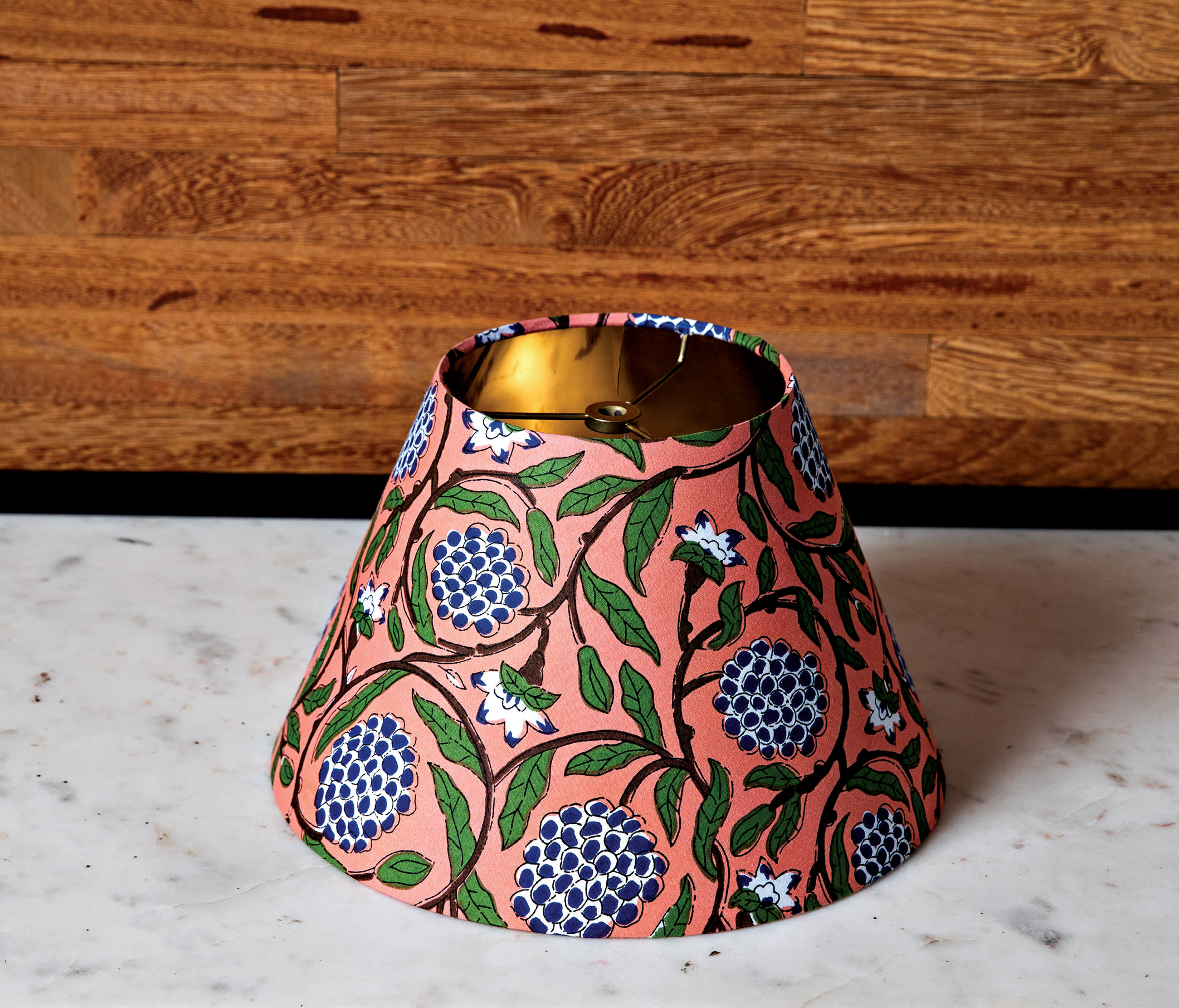 whimsical lamp shade with a pink, green and blue floral design