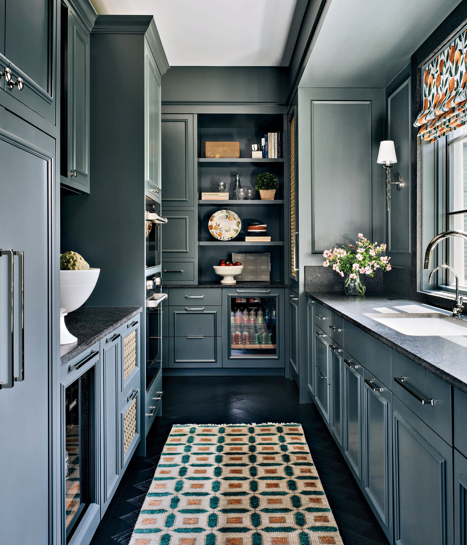 blue pantry with a colorful rug