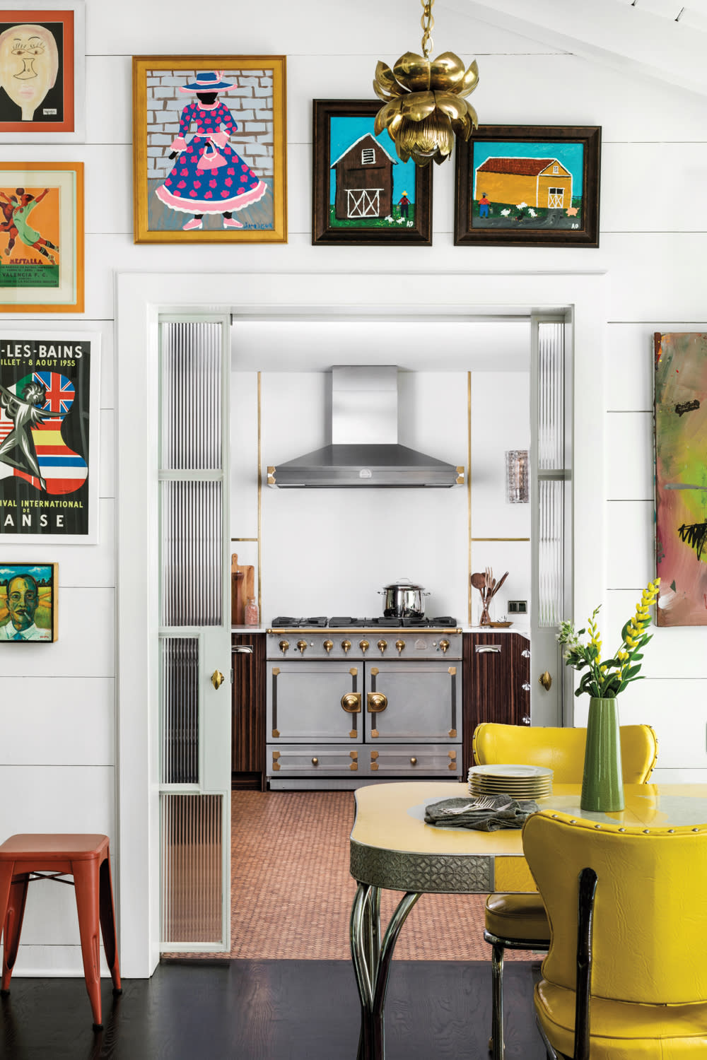 colorful dining room with La Cornue range and hood