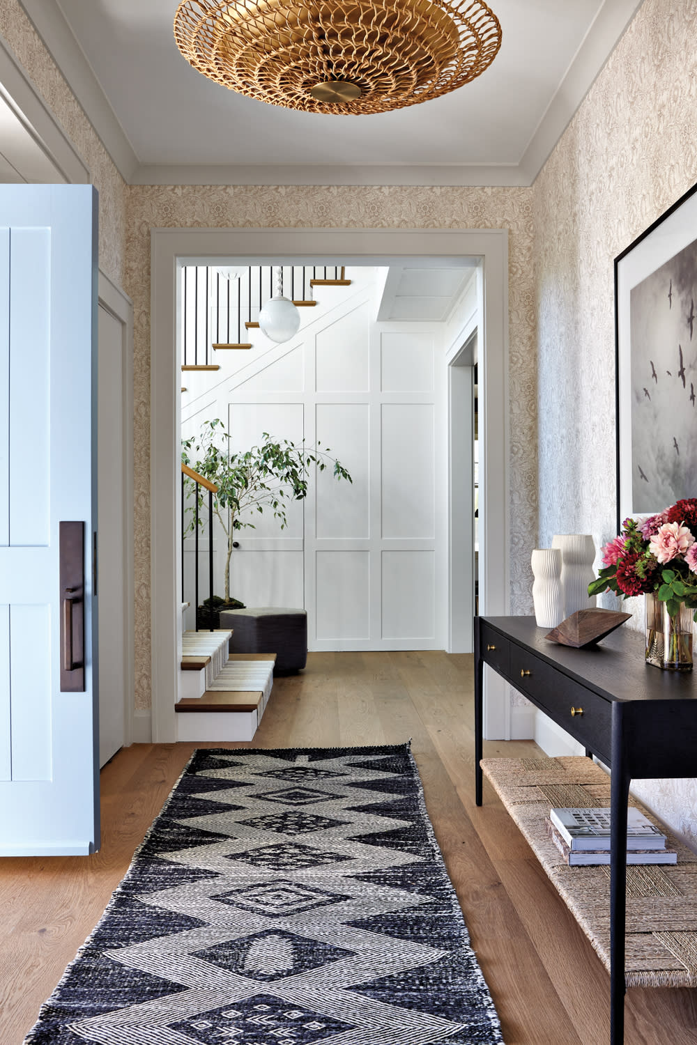 cottage entryway with poppy motif wallpaper