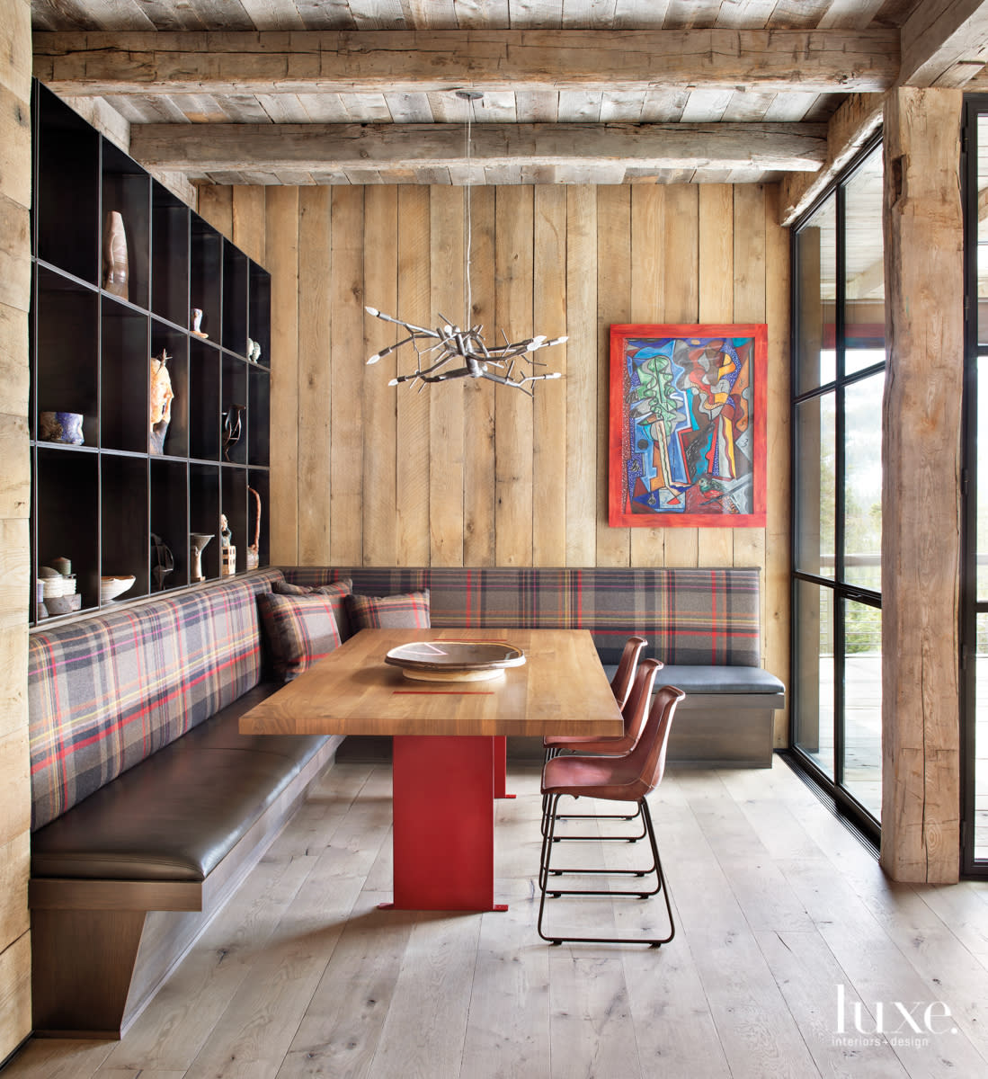Breakfast area with built in seating and antler chandelier above