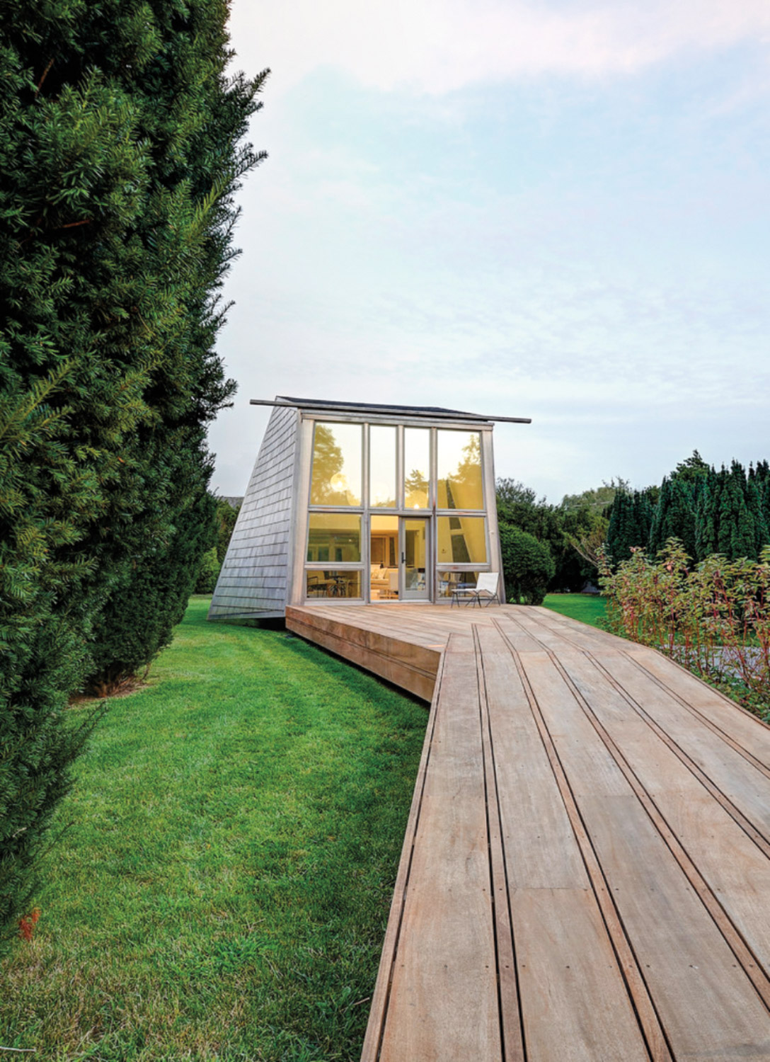 wooden walkway to glass structure