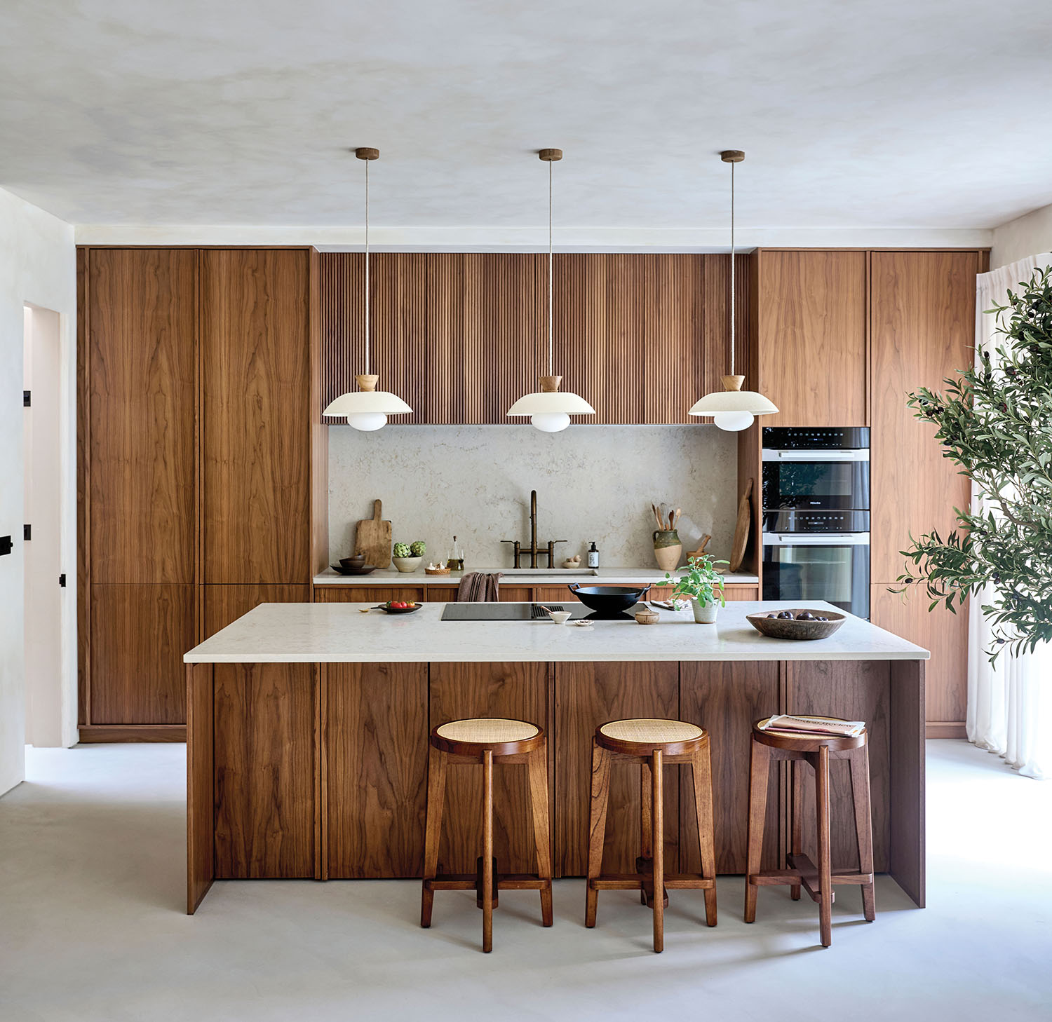 Warm walnut cabinetry in a quiet, contemporary kitchen