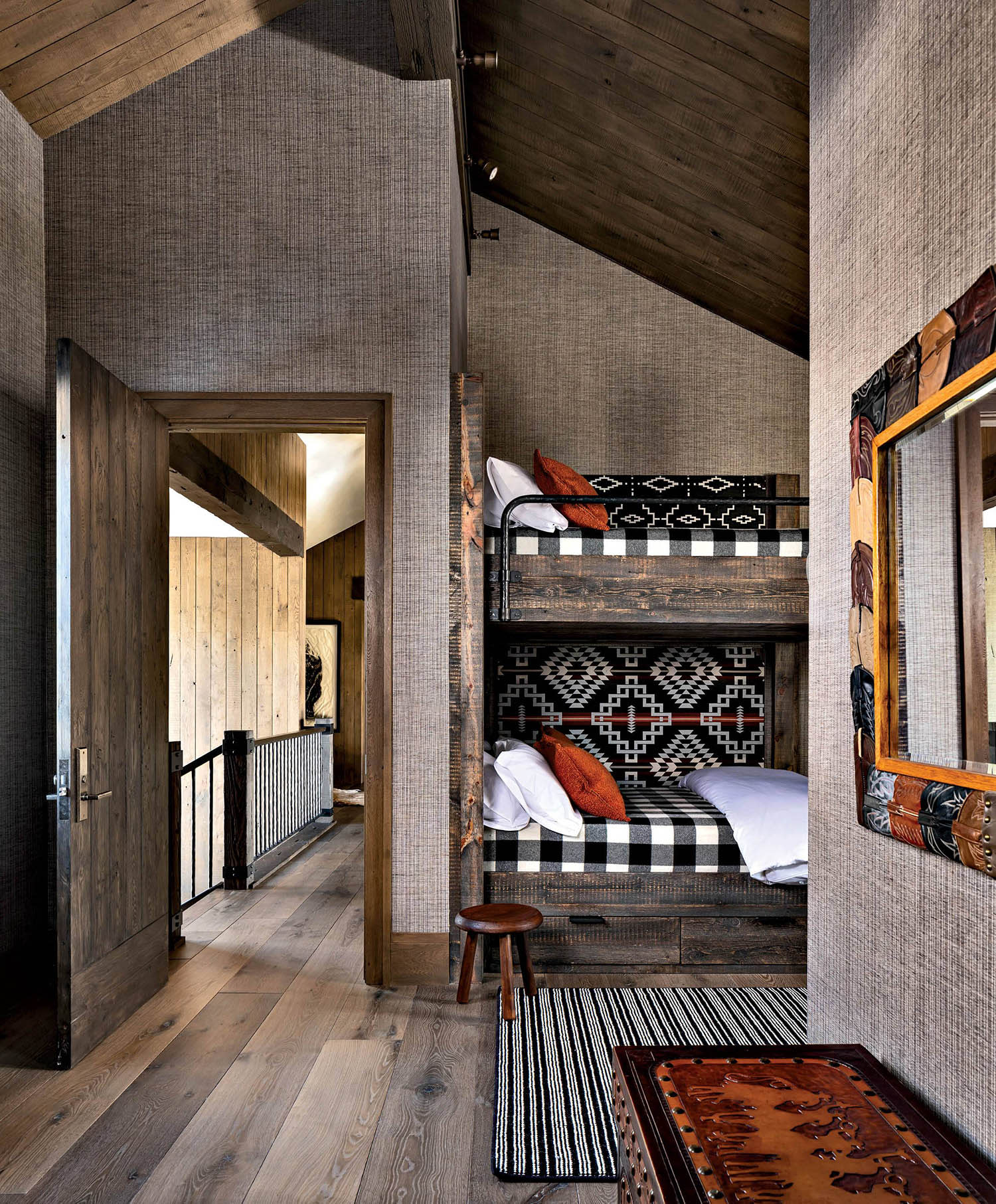 bunkroom with buffalo plaid coverlets on the beds