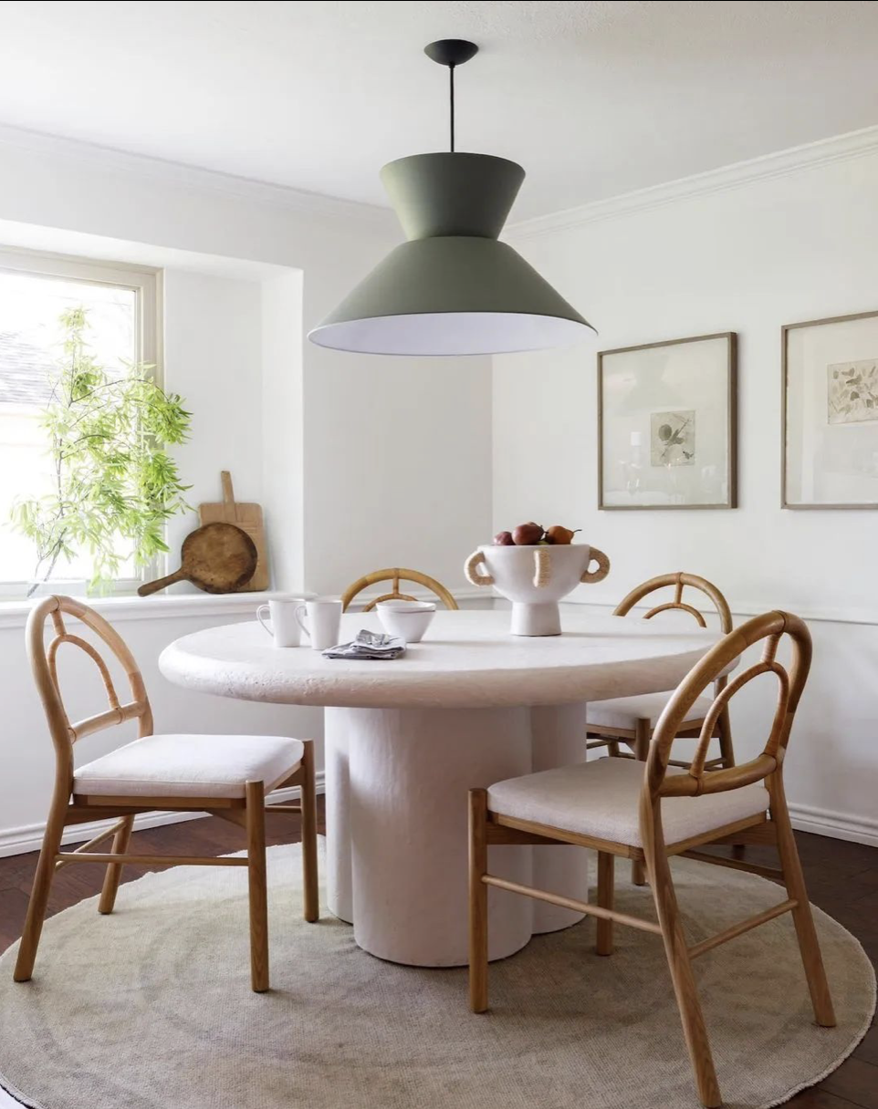 Circular Turkish rugs featured under the dining table.