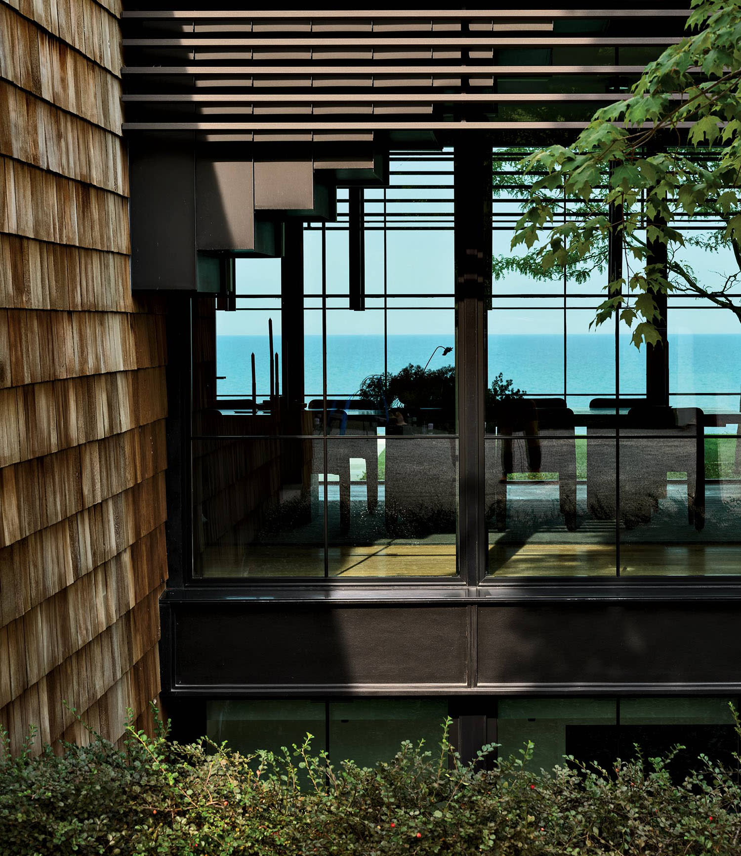 facade of a red cedar-shingled home