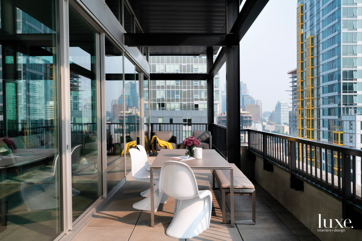 penthouse wraparound deck with outdoor table