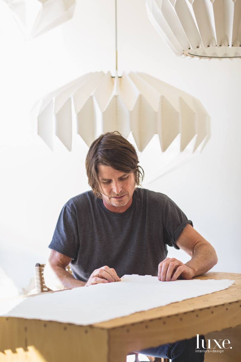 Models of Towey's lightweight and durable furnishings fill a shelf in his studio; his final designs are stripped of all non-essential elements.