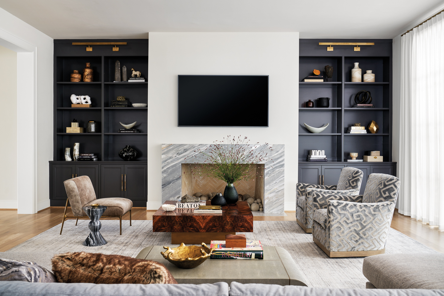 great room featuring open shelving, a fireplace and seating area