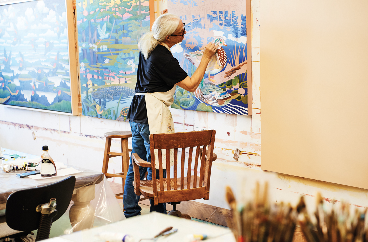 artist painting in his studio