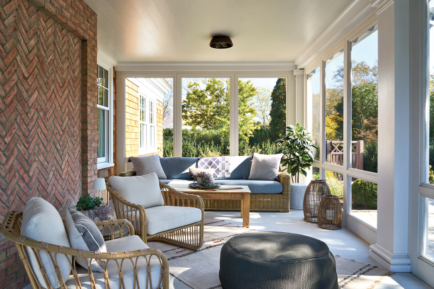 screened-in porch with cozy seating options