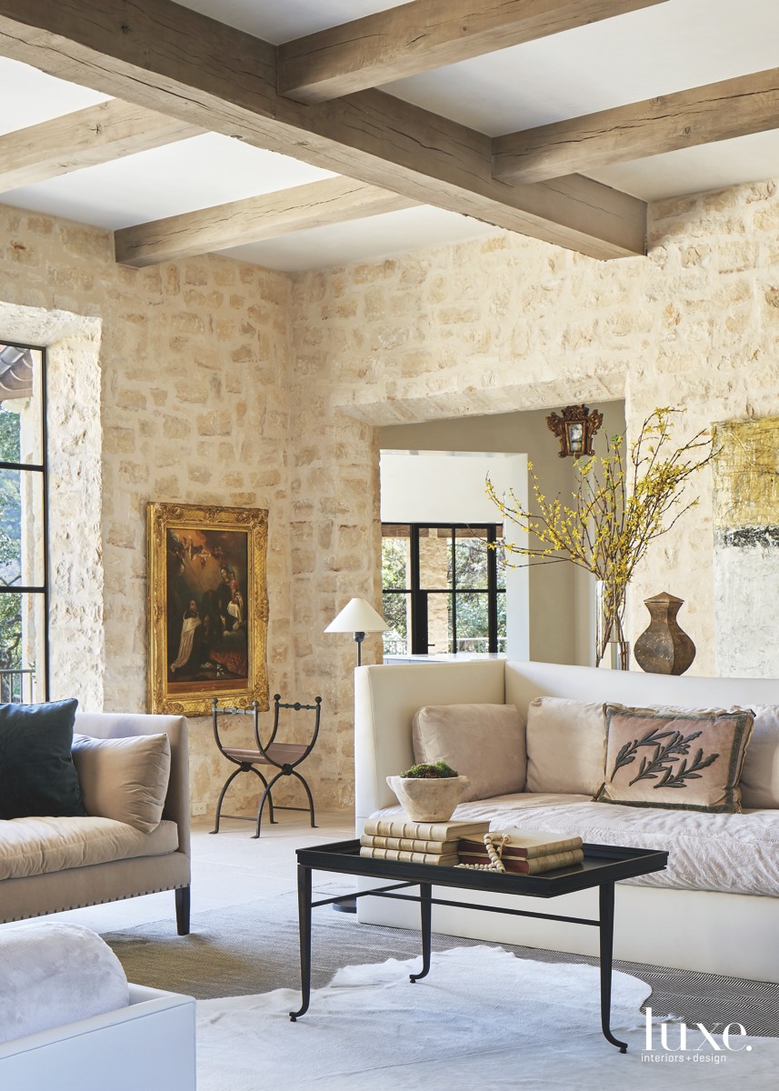 mediterranean neutral living room wooden ceiling beams