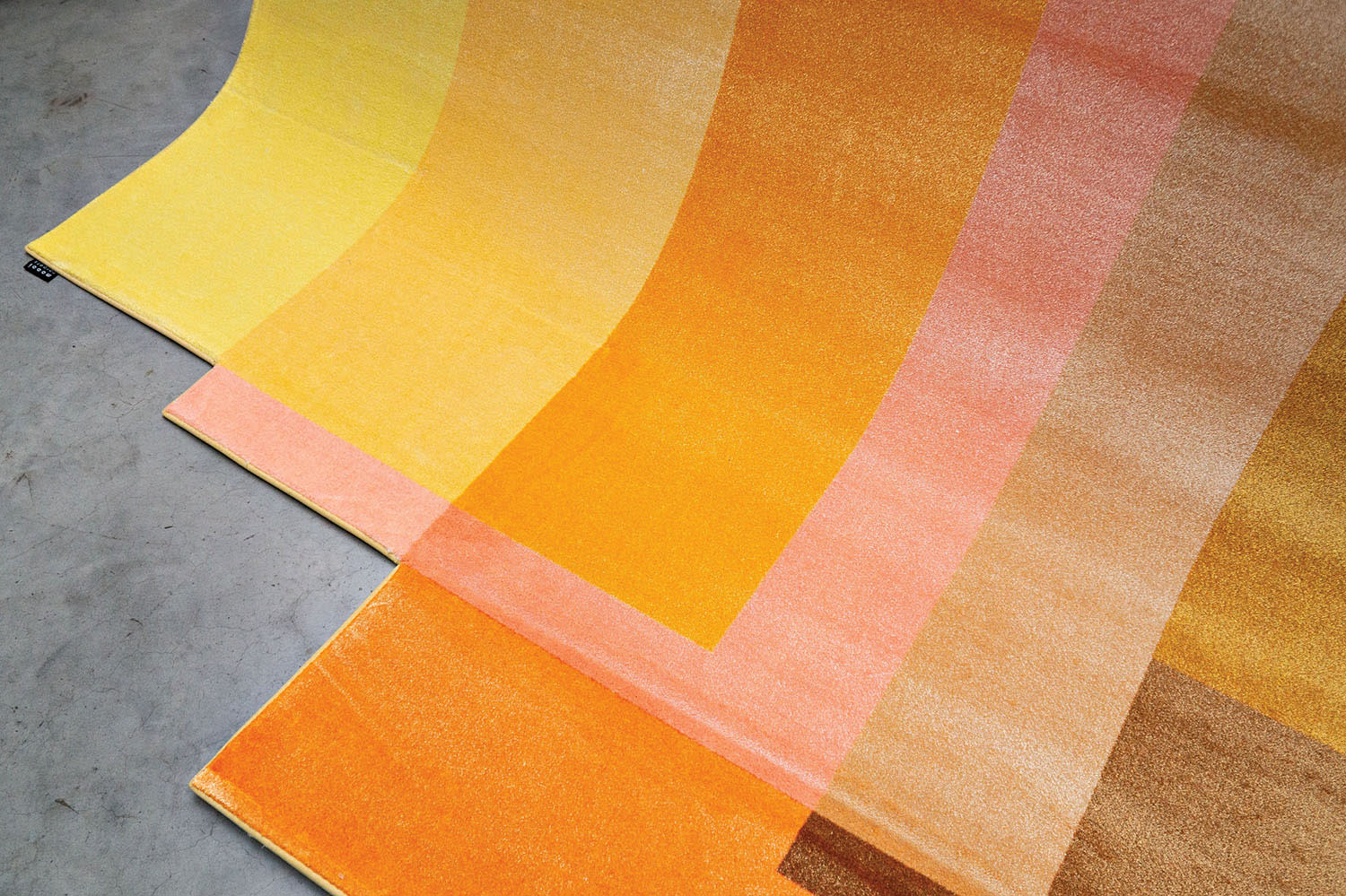 yellow, orange, pink and brown blended rug