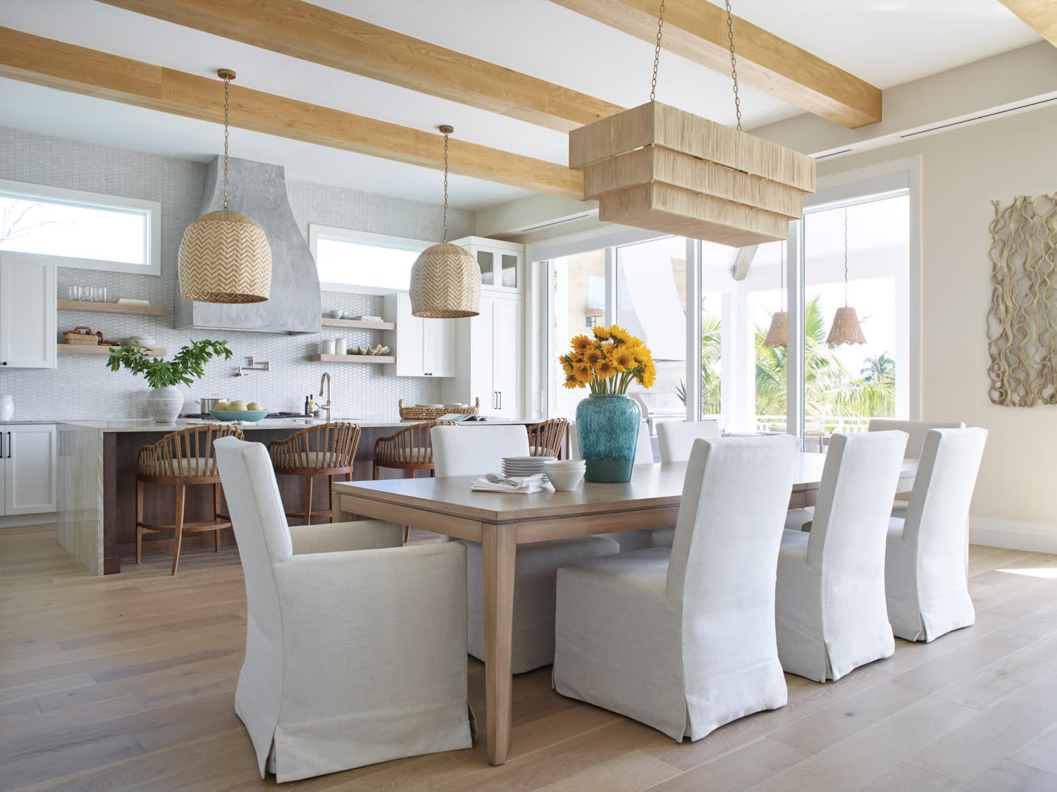 elegant white dining room with decorative ceiling beams