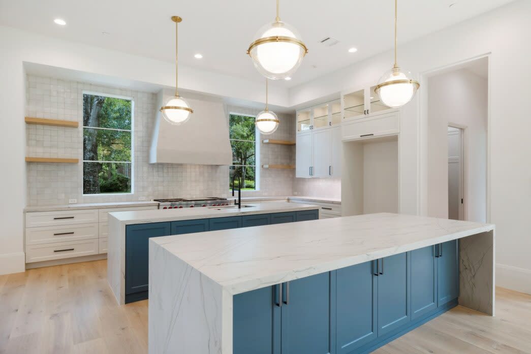 natural kitchen with pops of blue built by home builder in Houston, tx