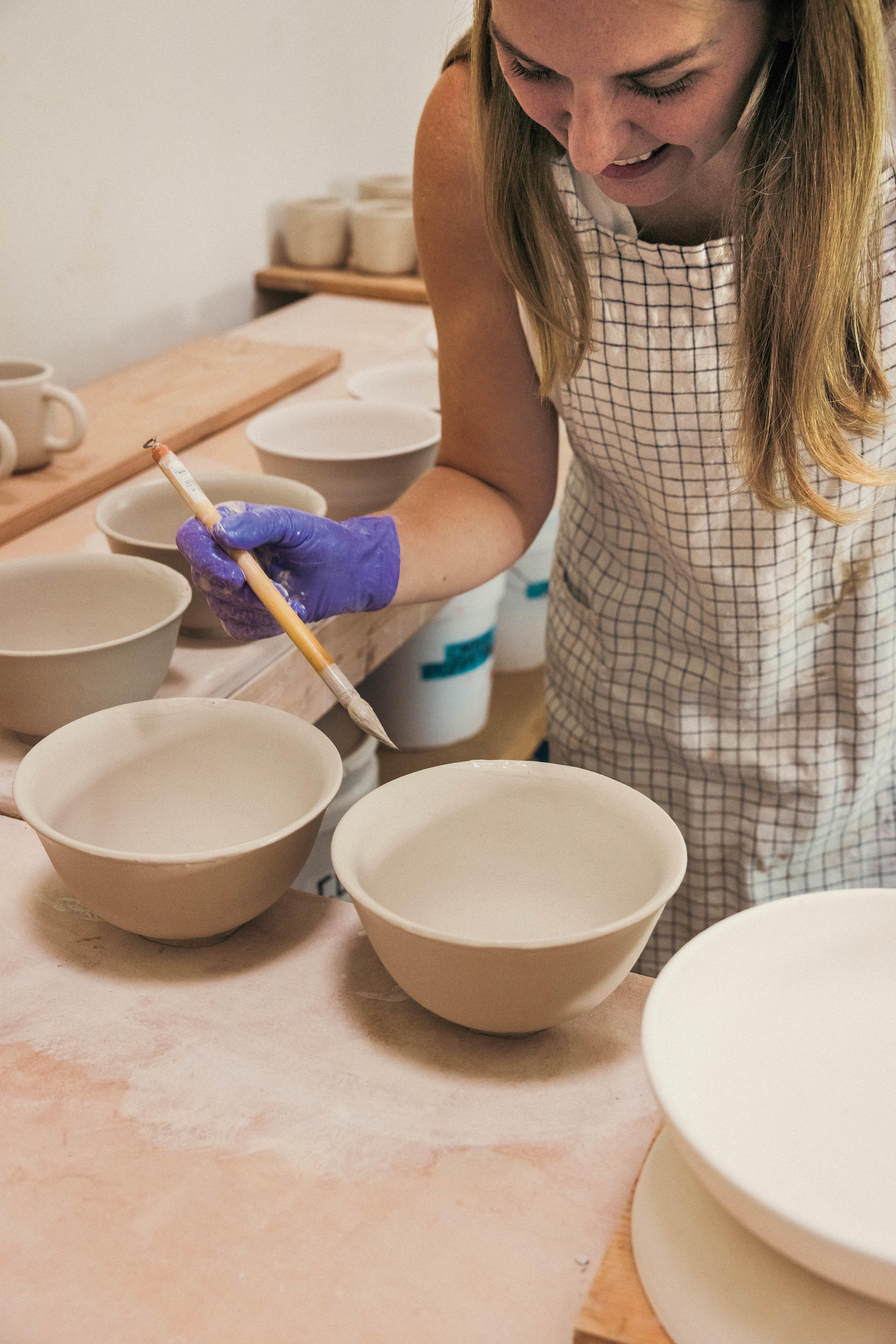 Lindsey Wohlgemuth working on her ceramics