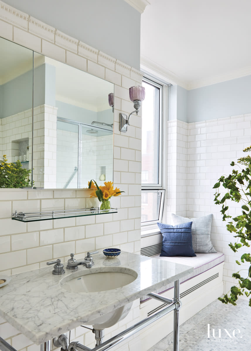 white bathroom with console sink and waterworks floor tile