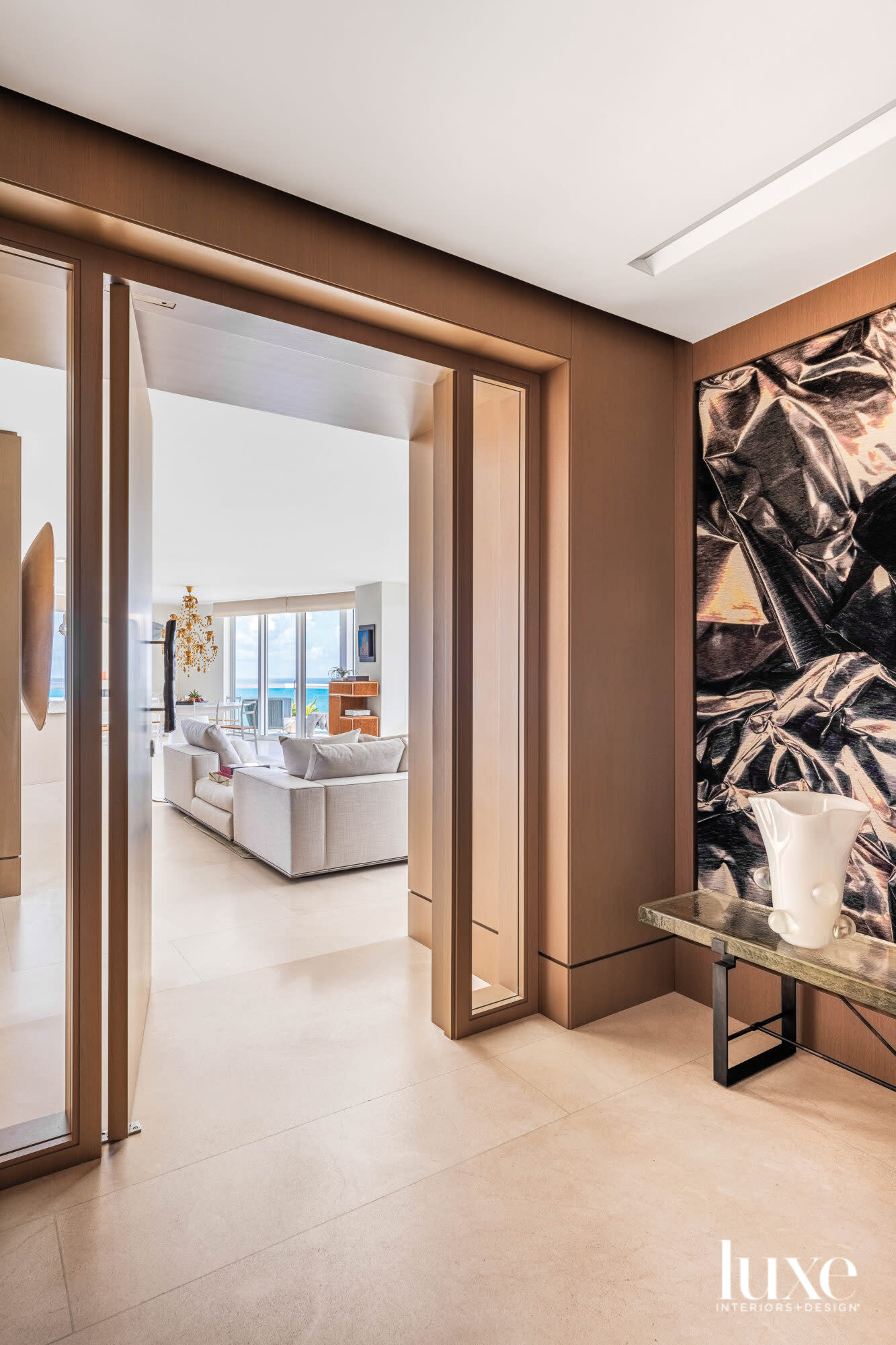 oak foyer with bench and large-scale artwork