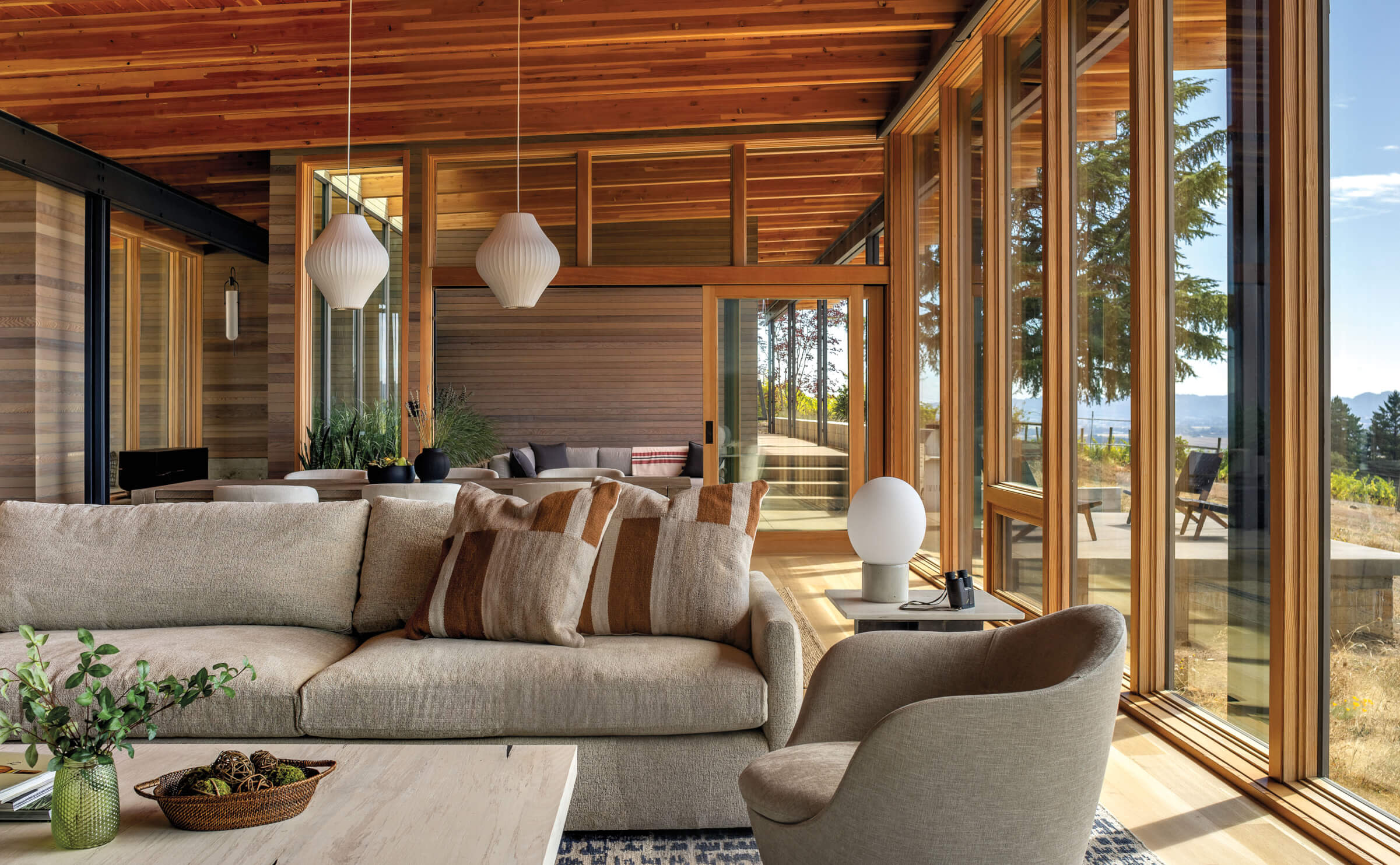 refined rustic living room with wood beam ceiling and a grey couch