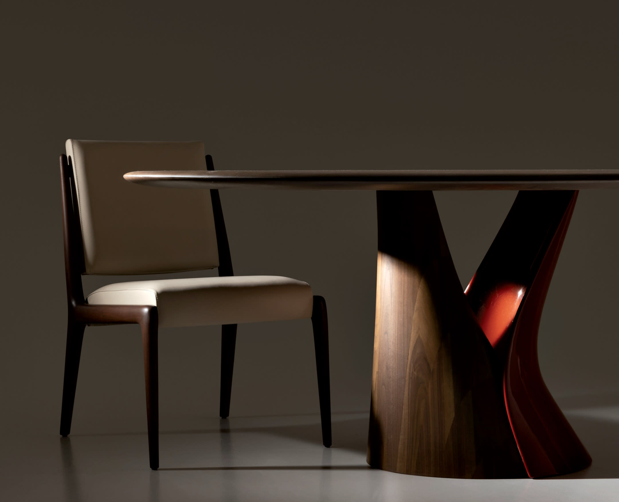 sculptural dining table and chair by Holly Hunt