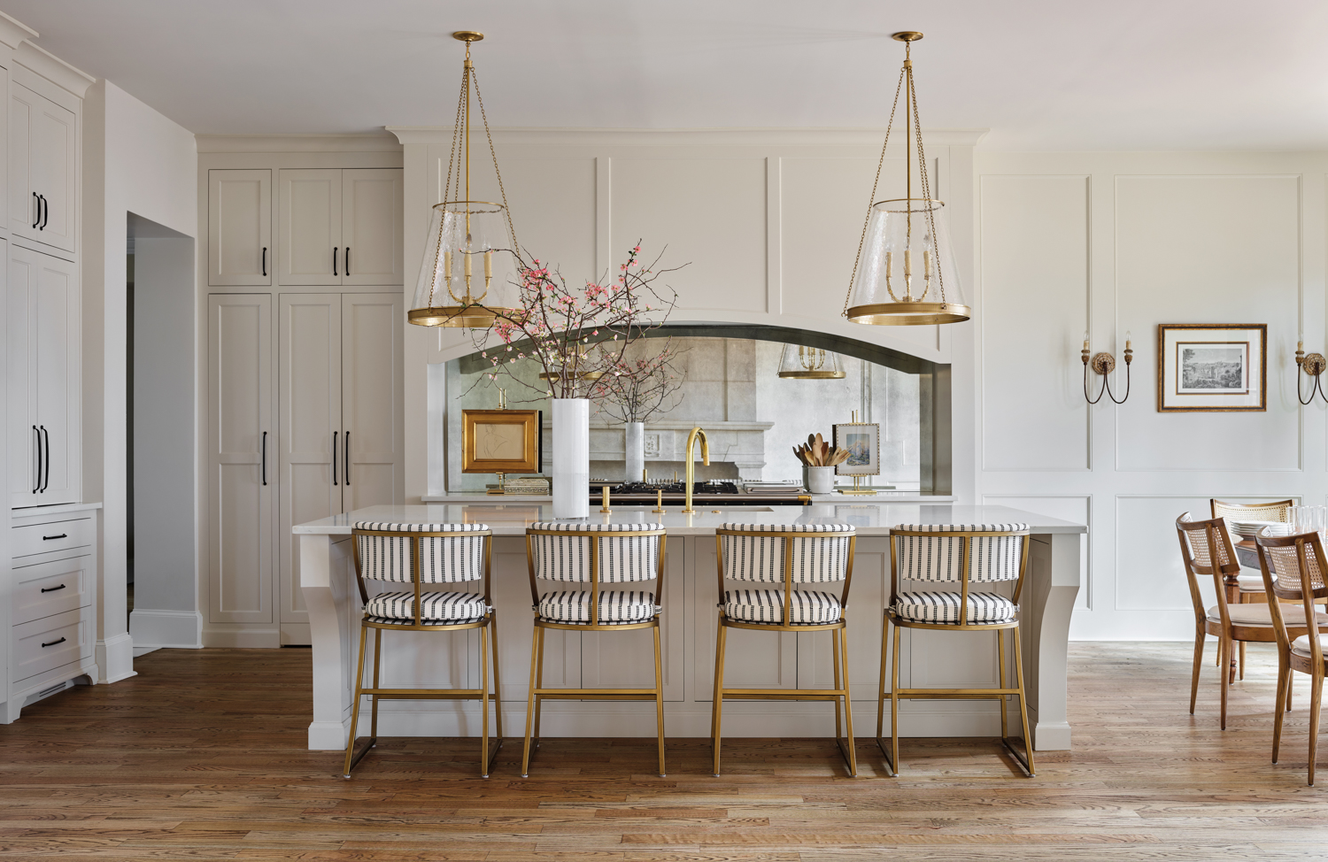 white monochrome kitchen with separate island and chairs