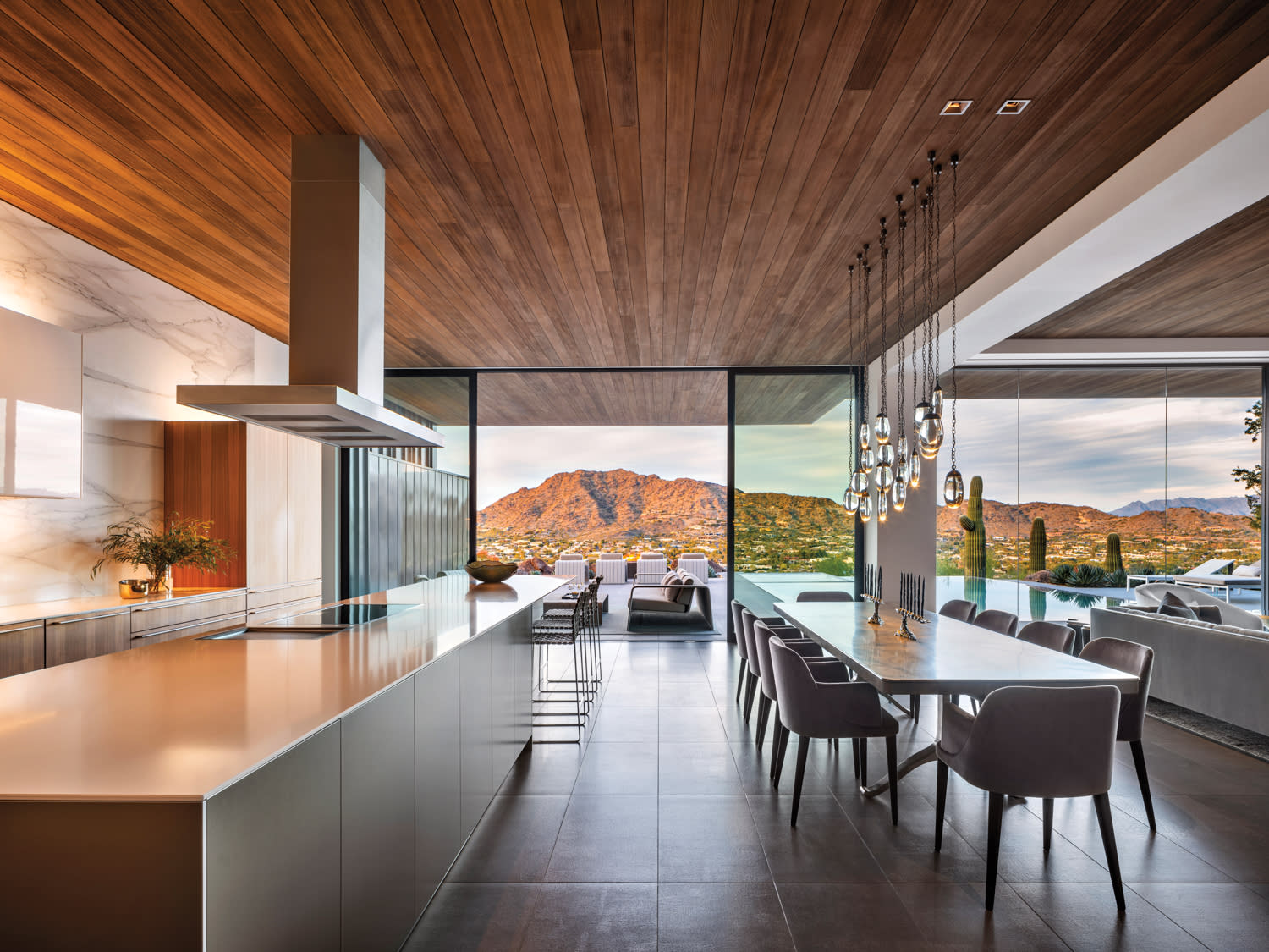 industrial and contemporary kitchen with a mix of walnut, aluminum and lacquer cabinetry