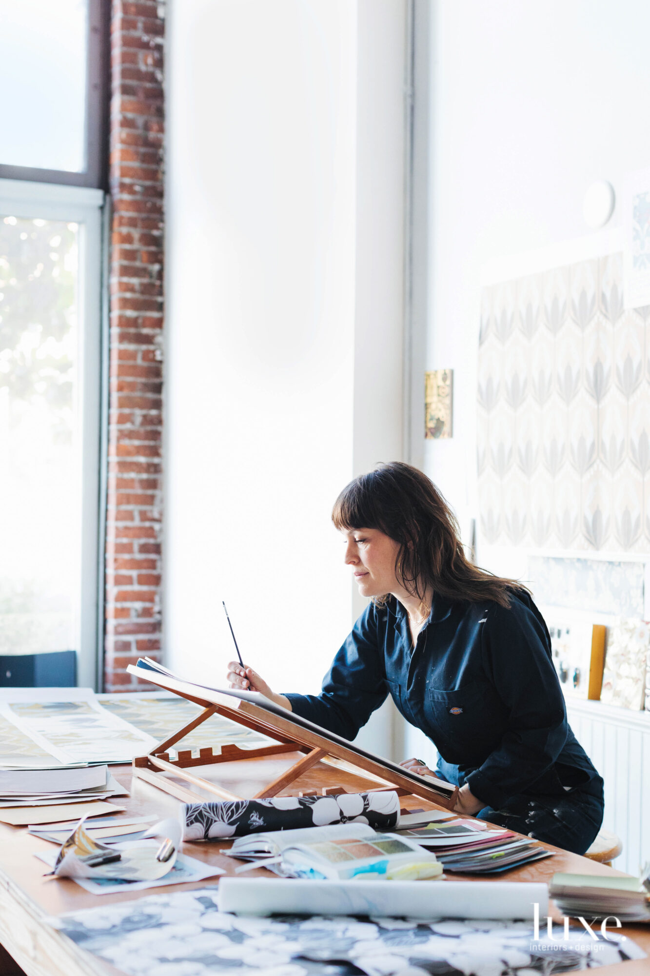 Melanie Catherine Nead sketches at a tabletop easel