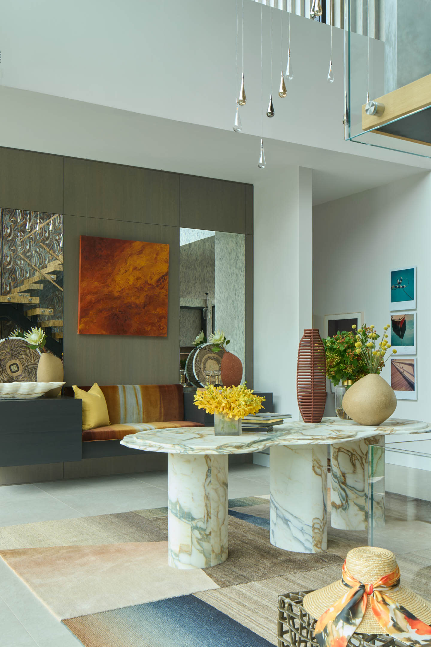 colorful, layered foyer with a marble table
