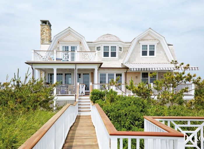To take advantage of the waterfront location, porches, terraces and paths that lead from the home to the beach were added, and on the bay side is a new pool and pool house. Despite the new elements, though, there was a focus on maintaining the beach cottage theme.