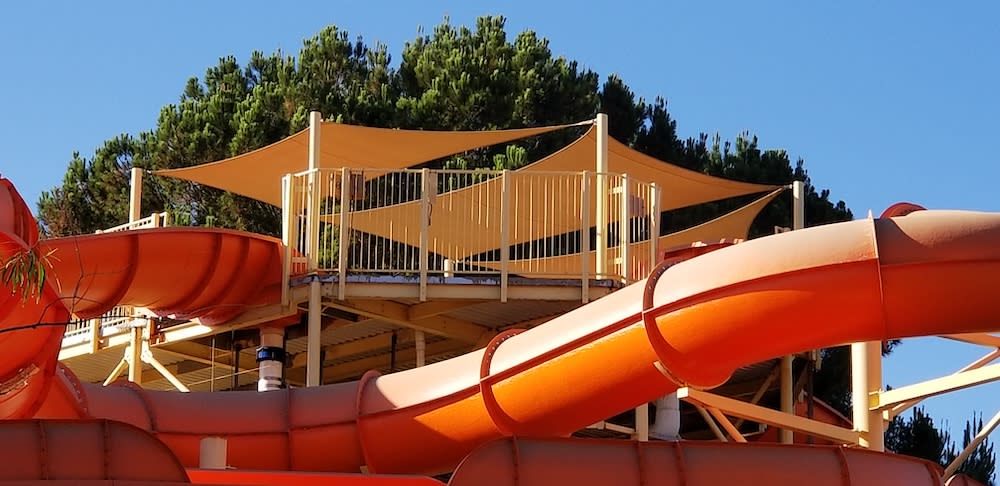 orange shade structure sail panel over magic mountain in California