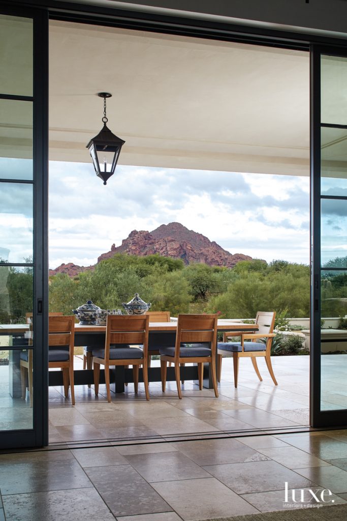 outdoor terrace with pendant light and mountain views