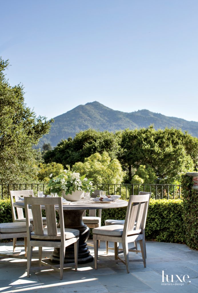 outdoor dining table with lush mountain views