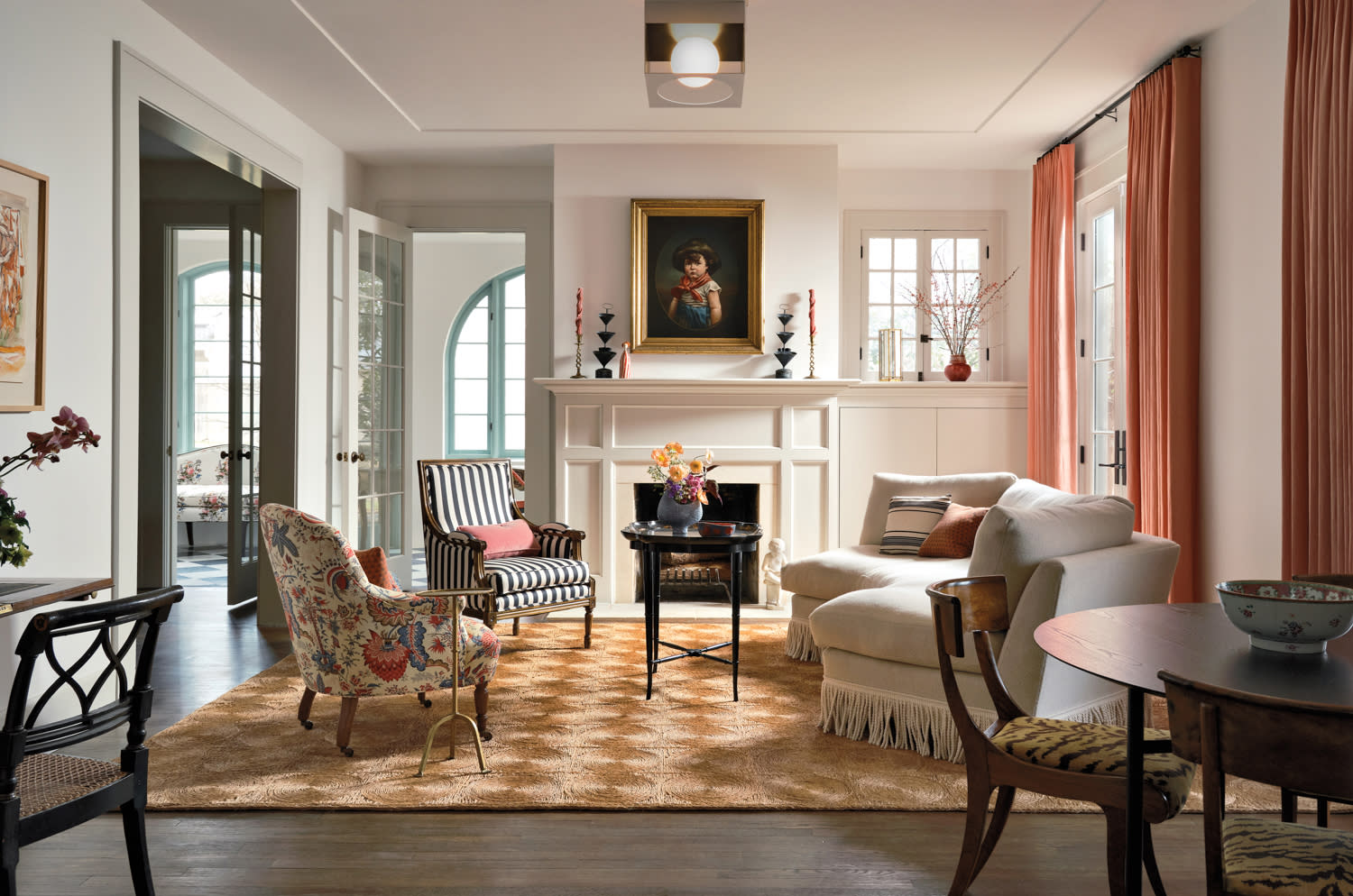 living room with a fireplace and fresh mix of furnishings