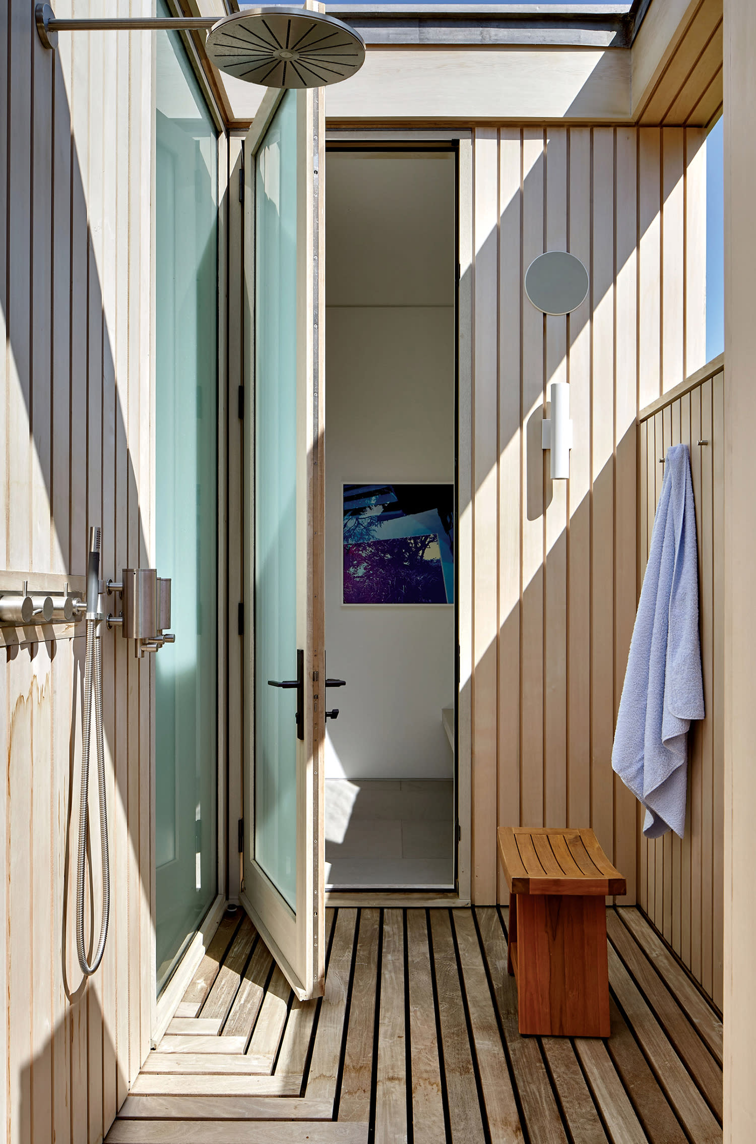 a neutral modern pool house shower