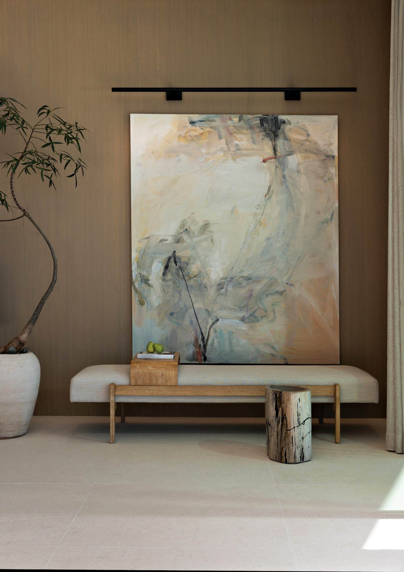 Curated art collection displayed throughout the home including paintings and sculptures.
