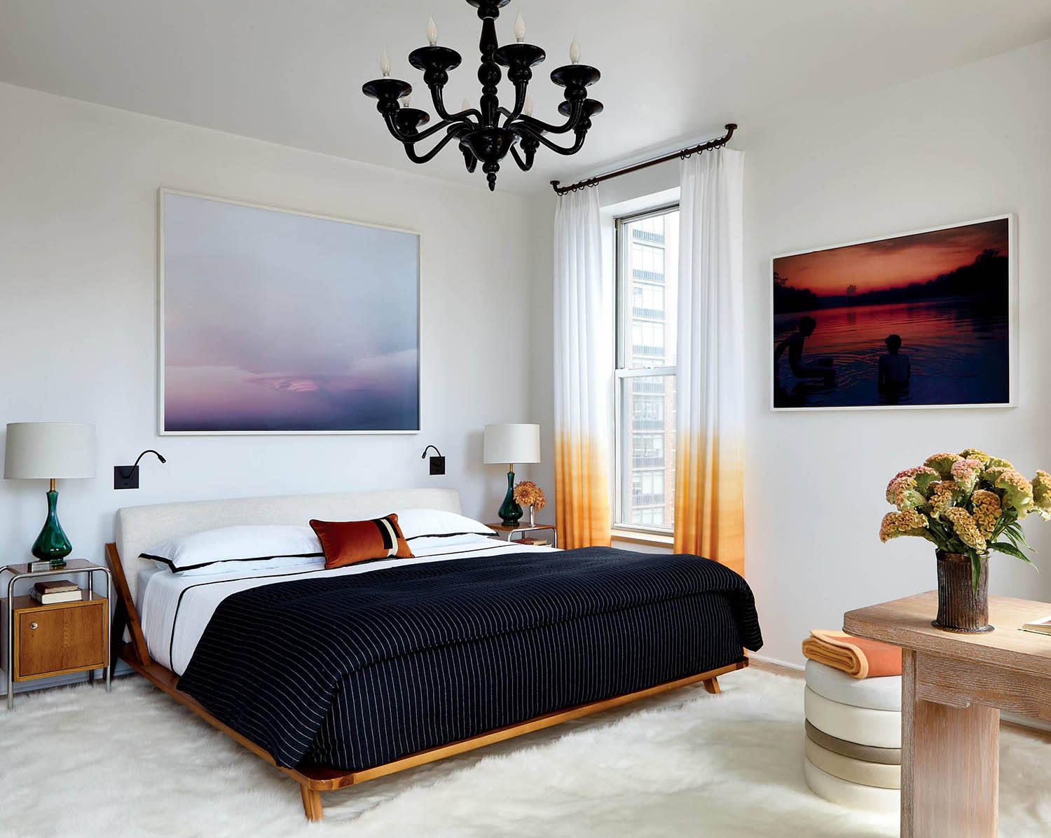 bright white bedroom with white and orange ombre curtains