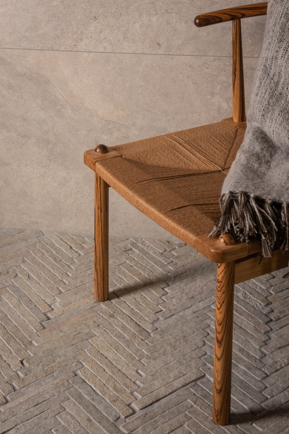 Bordeaux Argento Herringbone is a natural, beige-colored limestone set on a mesh backing in a herringbone pattern