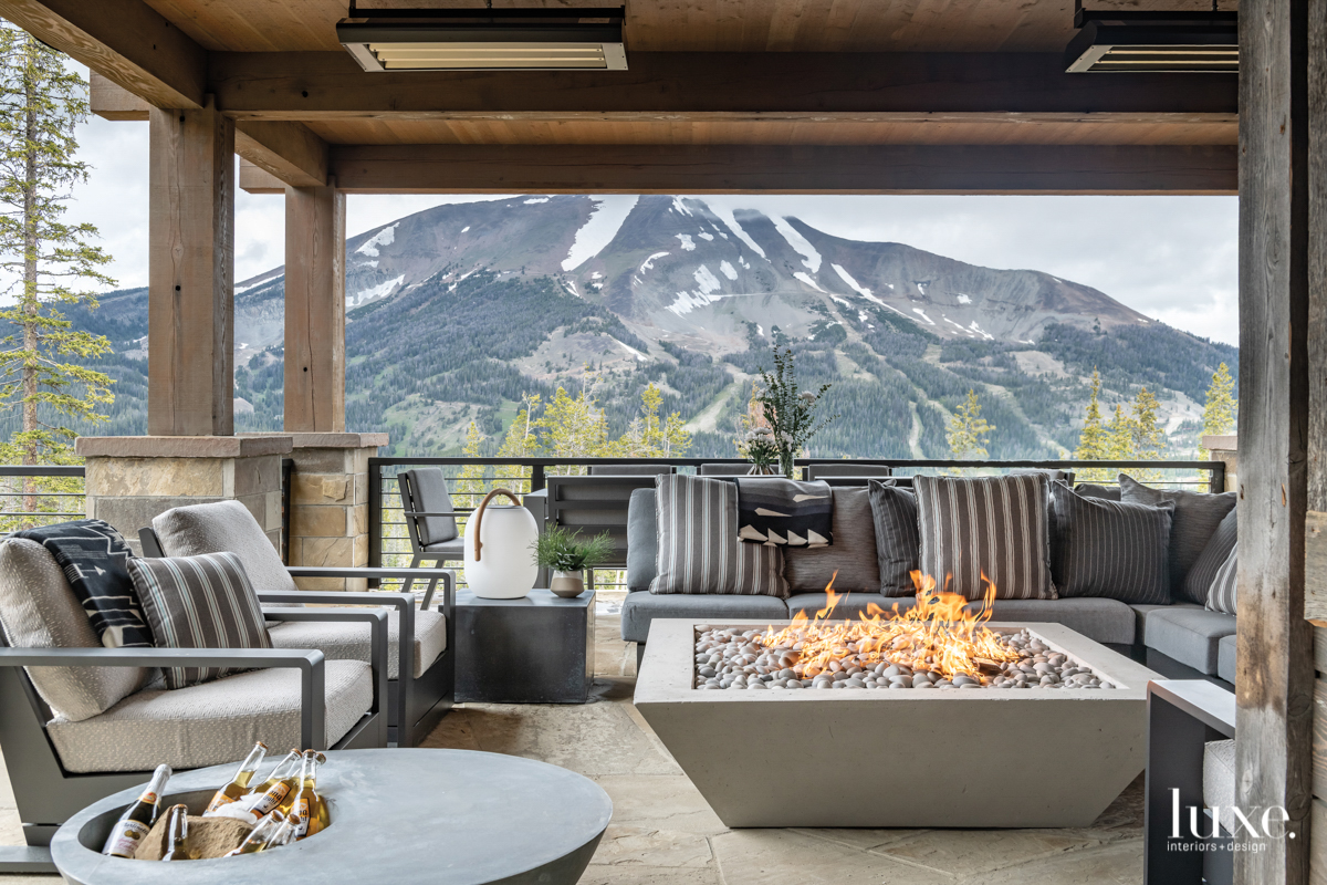 contemporary outdoor sitting area gray sofa and chairs fire pit