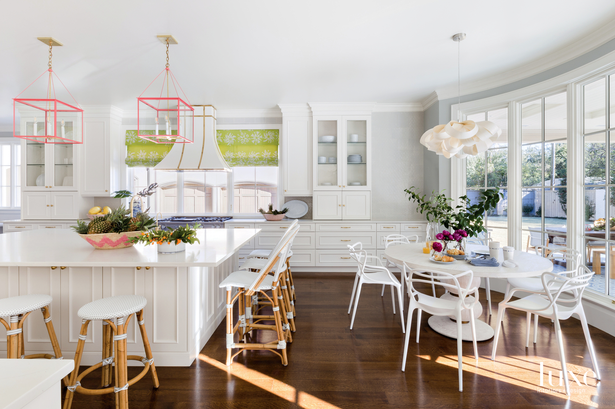 traditional white kitchen and white dining area