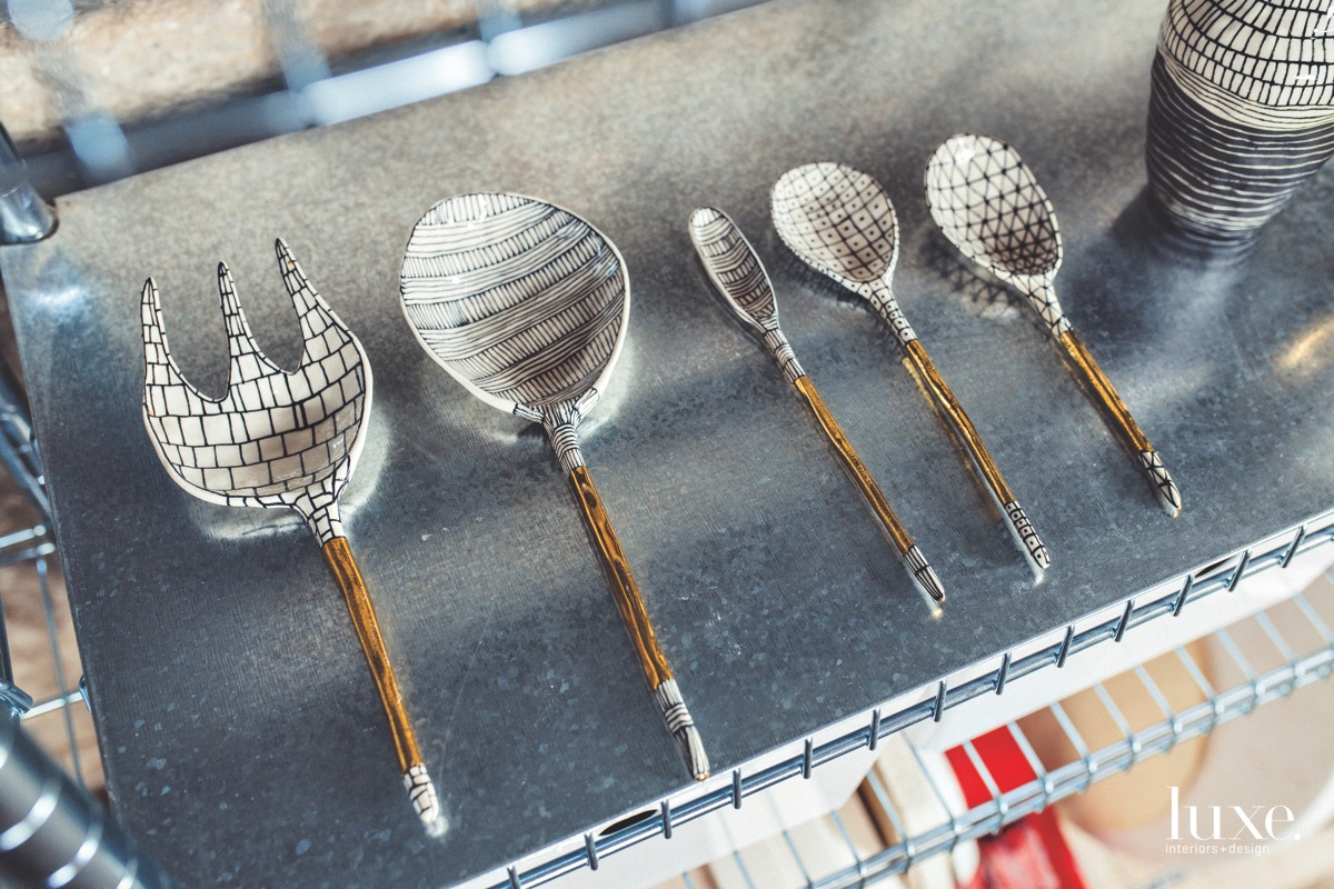 A selection of porcelain spoons with gold lustre handles.