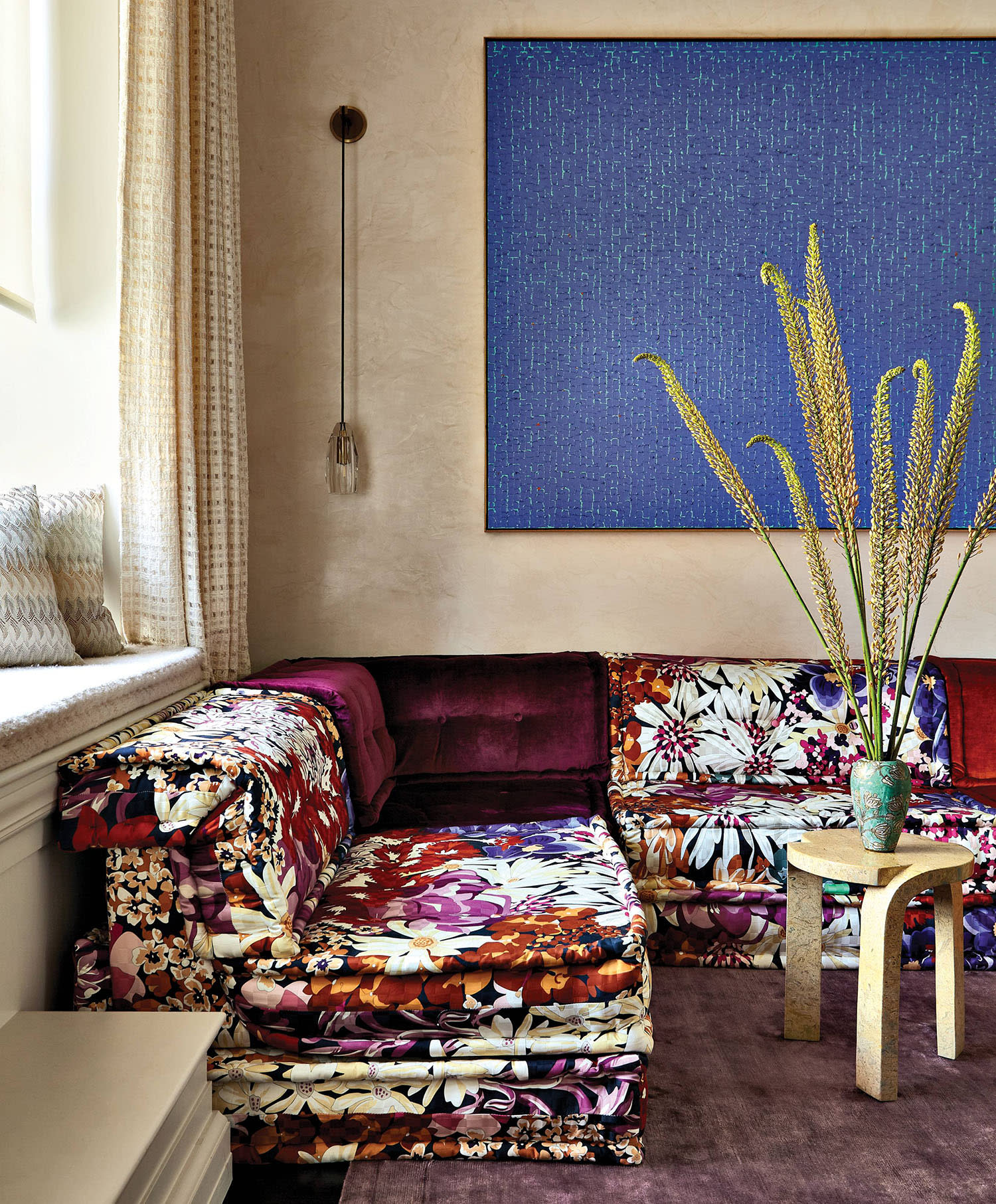 colorful couch in a Venetian plaster walled office and media room in a New York apartment