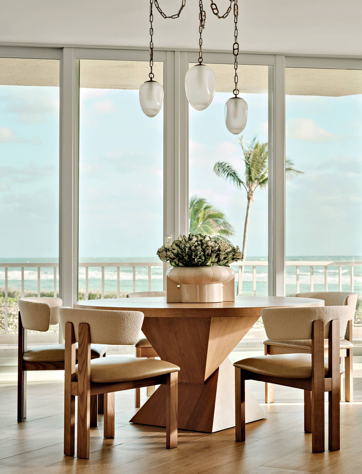 contemporary coastal dining room with views of the ocean outside