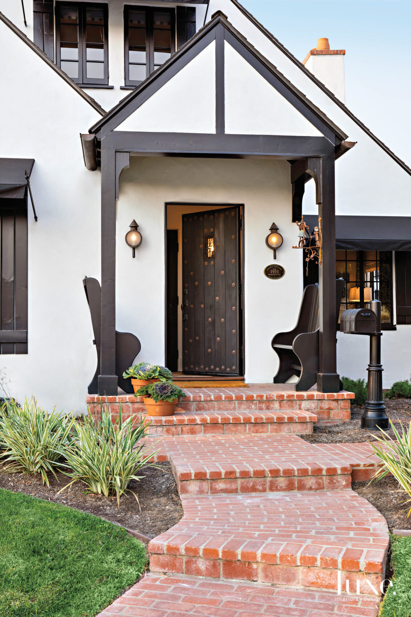 Entry to michael fullen's house with pair of benches in front
