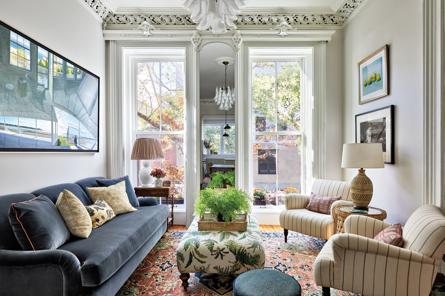 Living room with a green and blue palette in brooklyn brownstone by Rebecca Amir