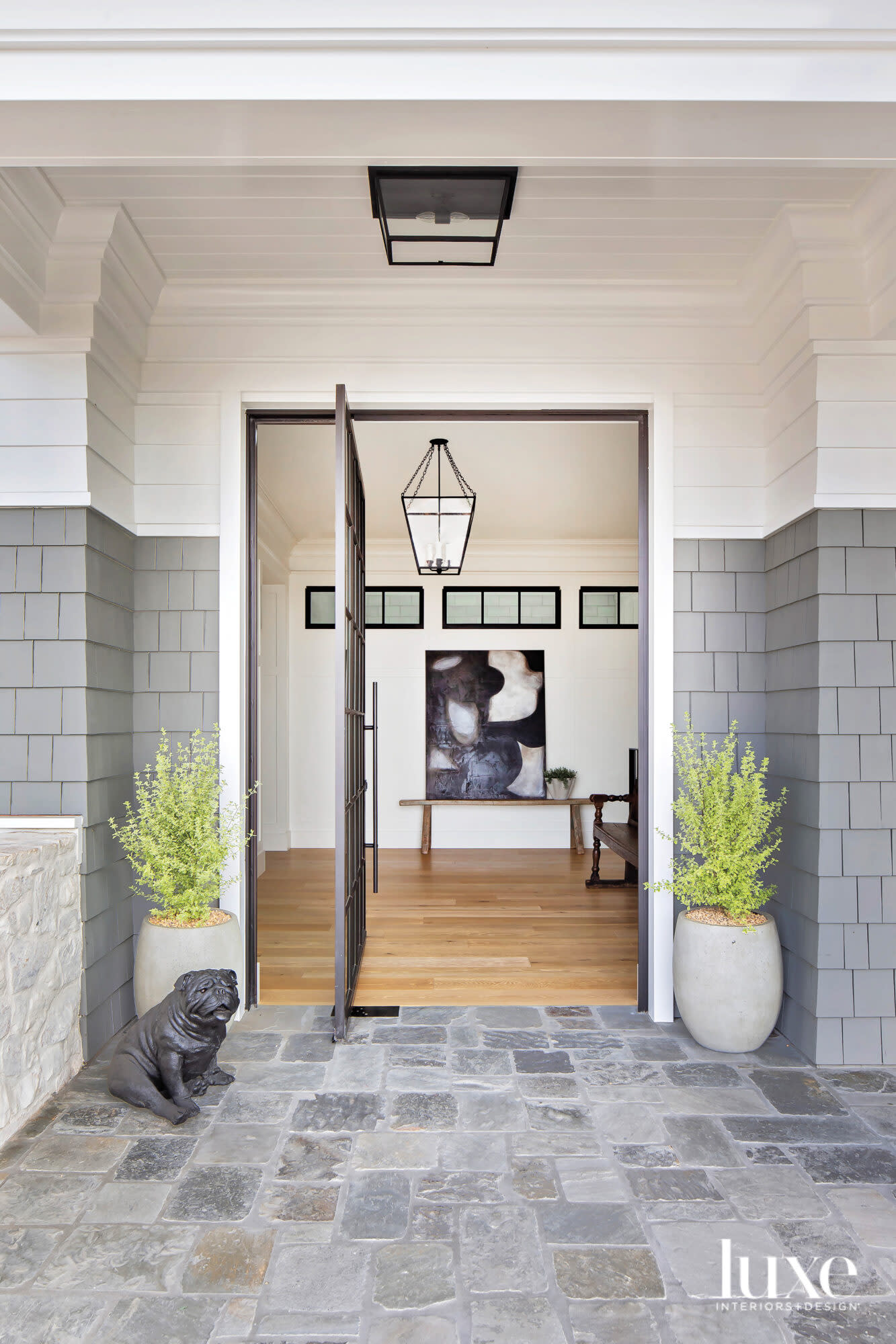 Entry door with small dog sculpture