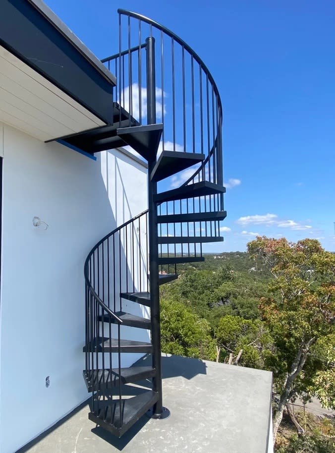 a spiral staircase outside of a building