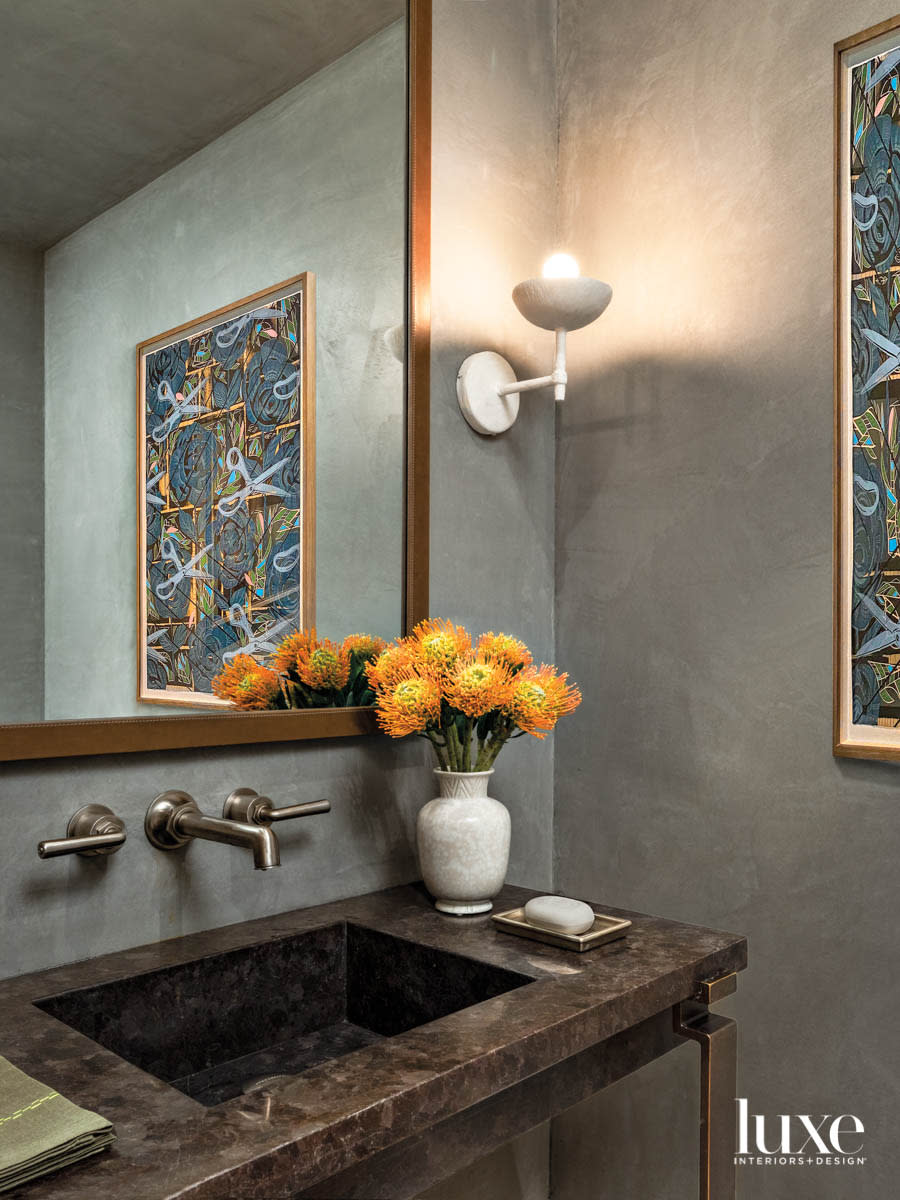 A powder room is done in shades of green