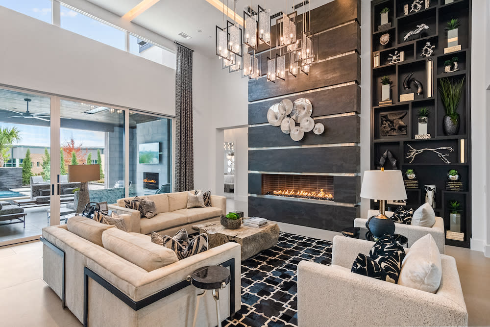 Living room featuring a dark wall with fireplace.