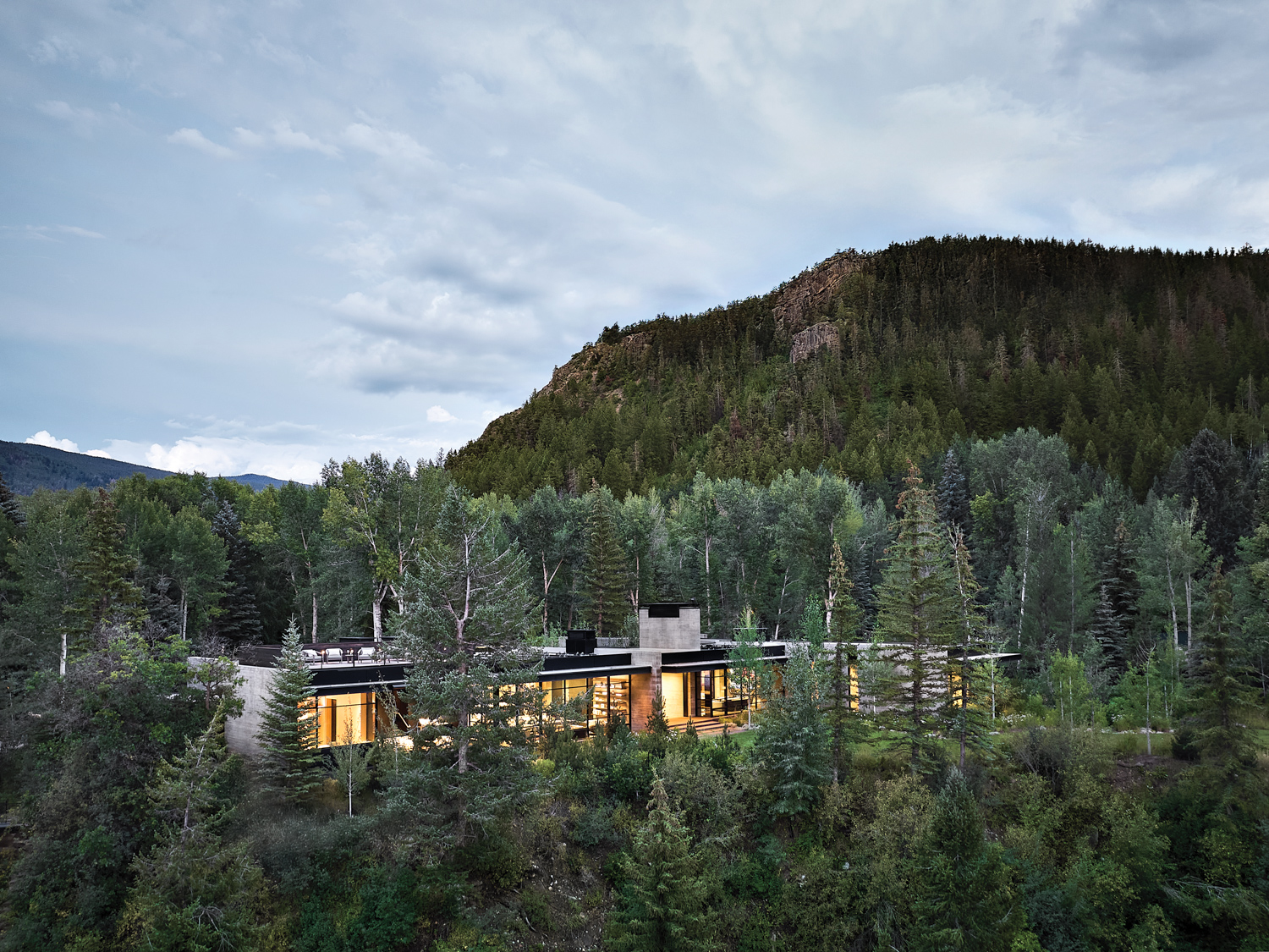 birds eye view of a Colorado mountain home surrounded by an Aspen forest