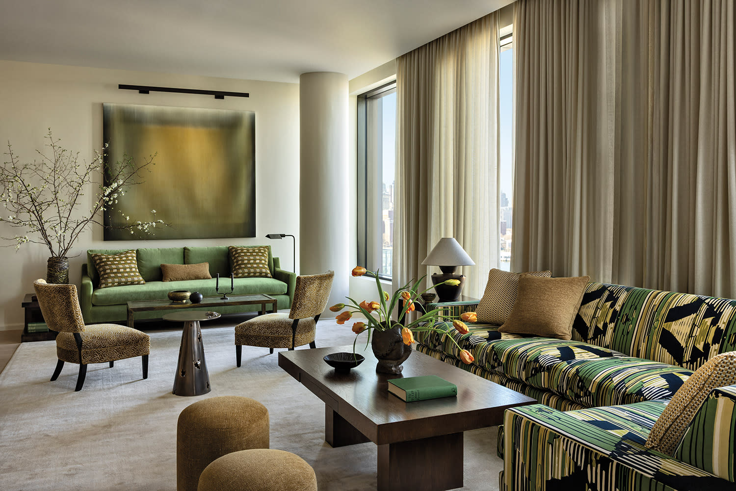 living room with a green and brown graphic print on the sectional